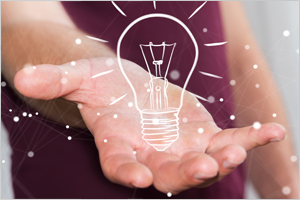 Virtualization Monitoring Solutions represented by image of a lightbulb in someone's palm.