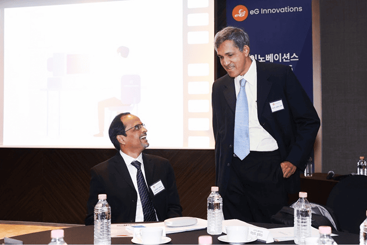 Anand Sampath (right) and Srihari Avar, Global Head of Solutions Engineering (left), in conversation ahead of the media interviews.